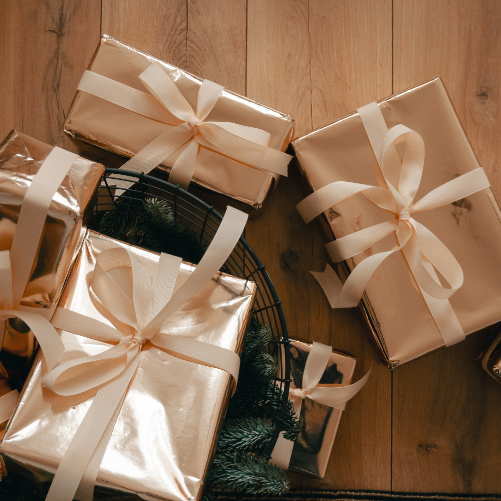 A beautifully wrapped gift box with a green ribbon
